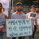 Image for article titled Some Indian men are running marathons dressed as ATM machines